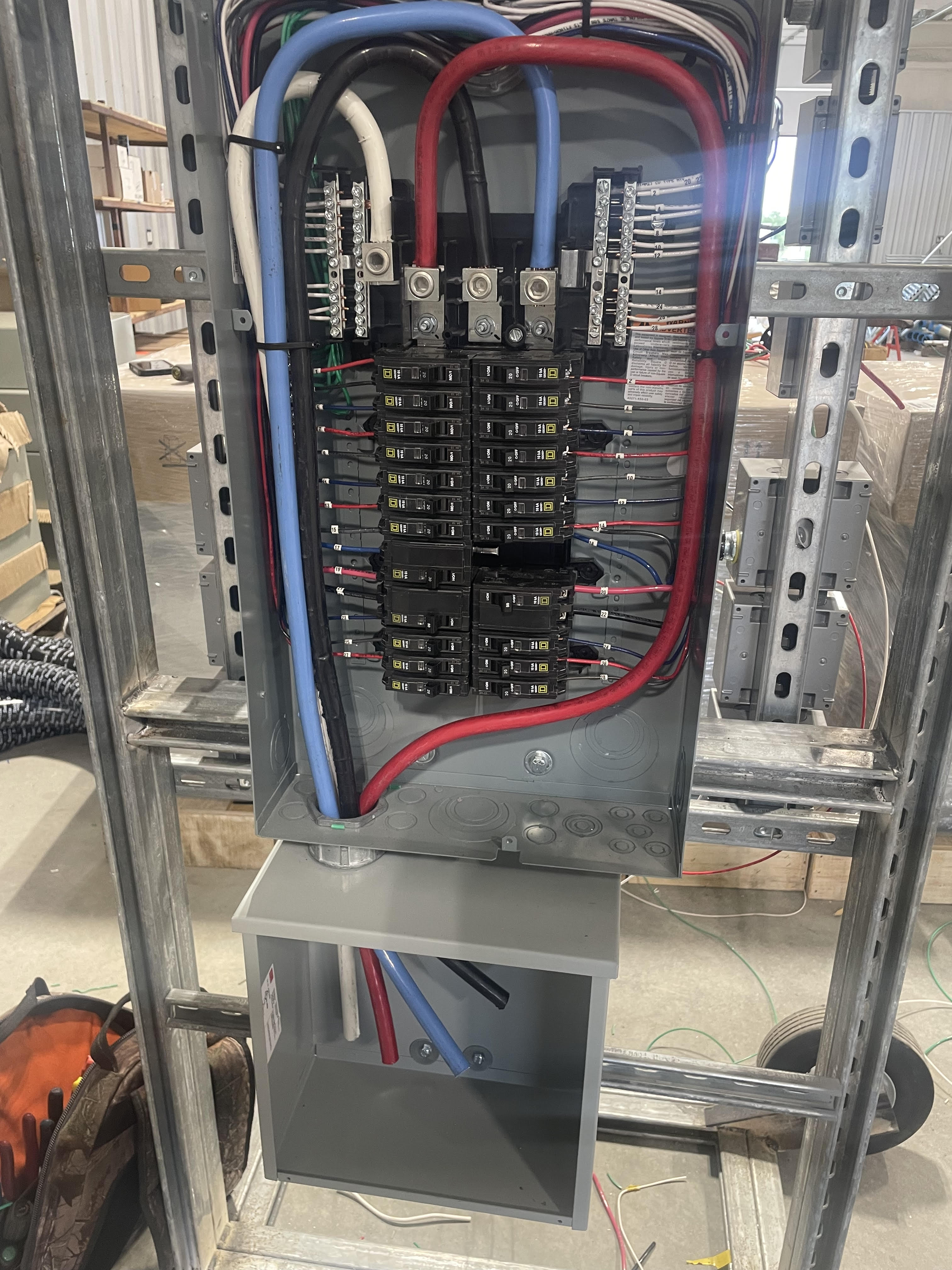 Residential electrical panel with organized color-coded wiring by Astral Electric Austin TX